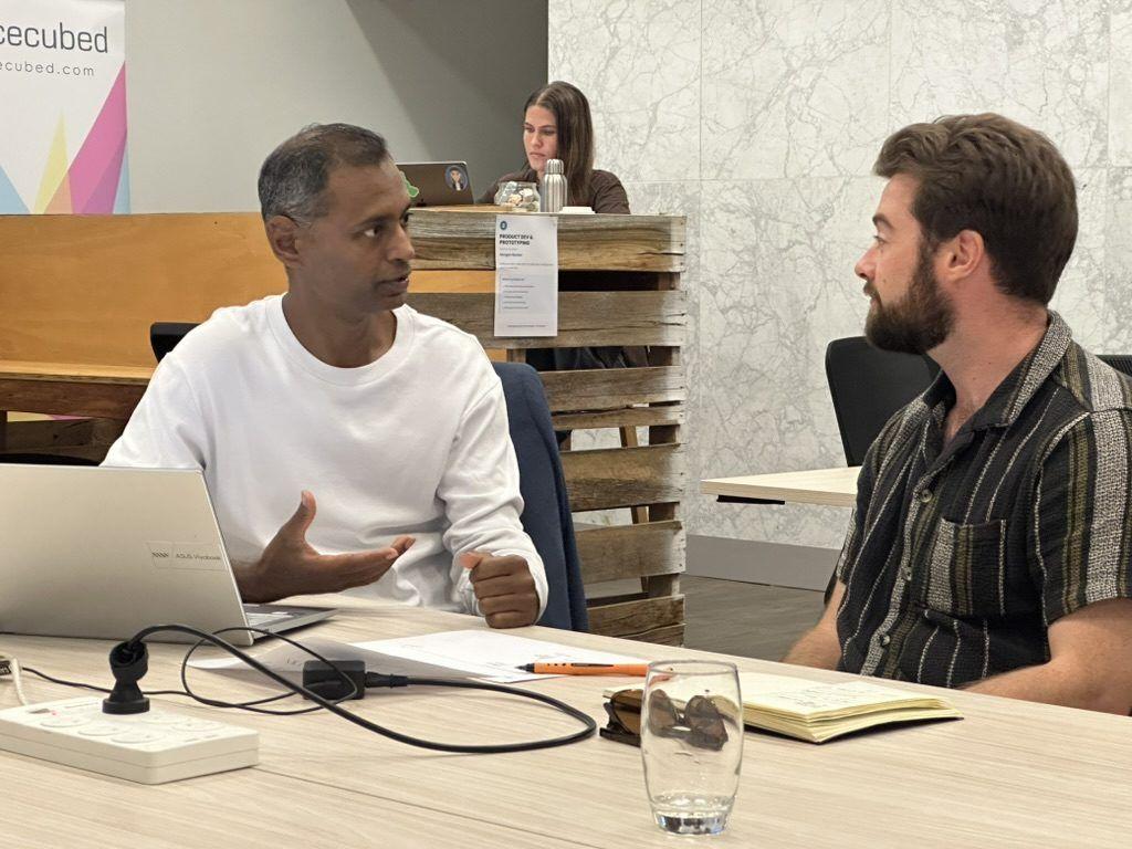 A mentor in conversation with a founder
