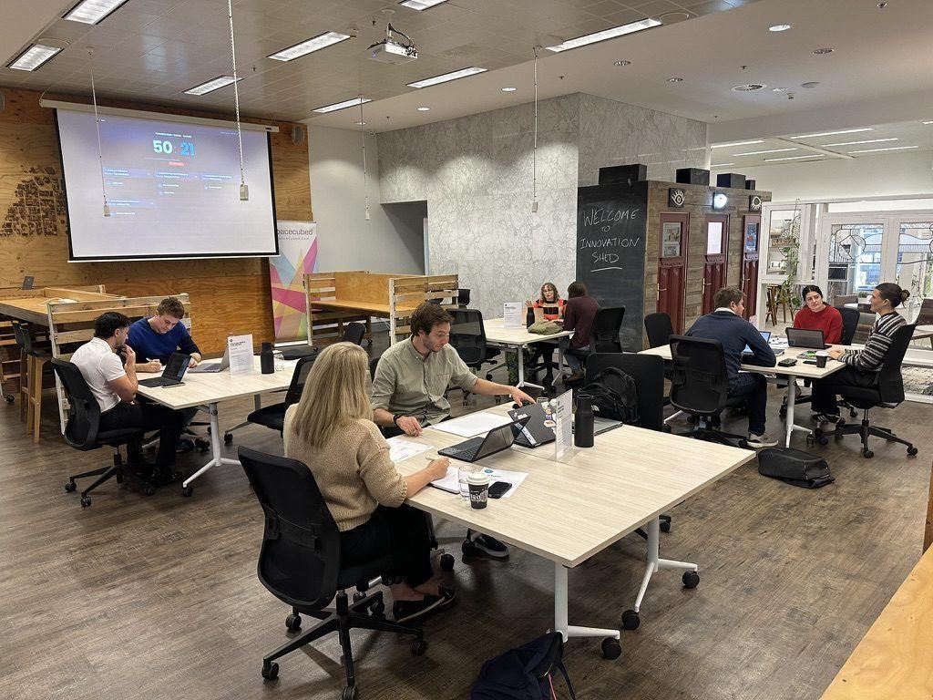 An Innovation Shed session with stations running across the room